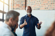© Nola Viglietti/peopleimages.com - Getting back to the matter at hand.... Cropped shot of a mature businessman giving a presentation in the boardroom.