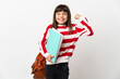 © luismolinero - Little student girl isolated on white background doing strong gesture