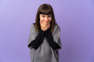 Wall Mural - Little girl over isolated background happy and smiling covering mouth with hands