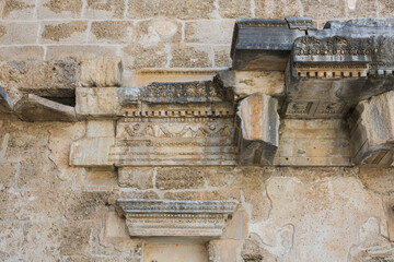 Wall Mural - The Walls Of The Old Amphitheater remember a lot. Ancient reliefs on the stone walls.