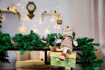 Christmas and New Year photo studio, green tree, garlands, glass for milk, soft chair, plush toy, white wall (3). For holiday like Christmas, Newyear, covers books, magazines, articles.
