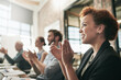 © Thurstan Hinrichsen/peopleimages.com - Keep an open mind to all ideas and comments shared. Shot of a team of businesspeople clapping hands while having a meeting in an office.