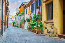 Narrow Street Of The Village Of Fishermen San Guiliano With Colorful Houses And A Bicycle In Early Morning In Rimini, Italy