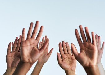 Poster - Raise your hands in support of each other. Shot of a group of hands reaching up against a white background.