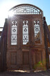 Antique large wooden doors with metal details