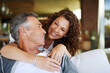 © Daniel Laflor/peopleimages.com - I love you. A handsome mature man being lovingly embraced by his smiling wife.