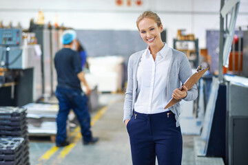 Aufkleber - Focused on raising the bar each step of the way. A young manager looking confident while on the factory floor.