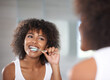 © Mapodile M./peopleimages.com - Keeping her smile. Shot of a a young woman brushing her teeth.