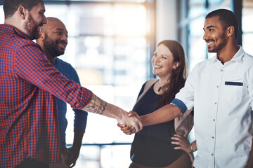 Wall Mural - Dealing with all the right people. Shot of businesspeople shaking hands in an office.