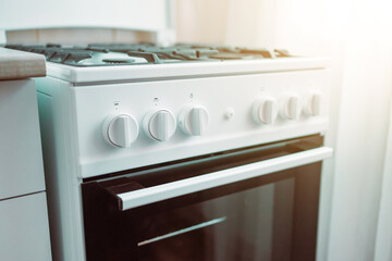 Close up of stylish new white gas stove in a kitchen