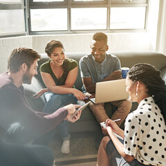 Wall Mural - Change of scenery to inspire creativity. Shot of a team of colleagues having a meeting on a sofa in a modern office.