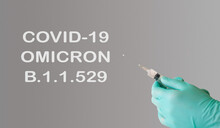 A Doctor Holds A Vaccine Against A New Variant Of Omicron Covid-19. Vaccine Against The South African Variant Of The Coronavirus Covid-19 Omicron B.1.1.529