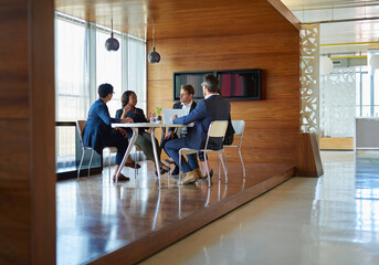 Wall Mural - Meeting is session. Shot of a group of corporate businesspeople working in the boardroom.