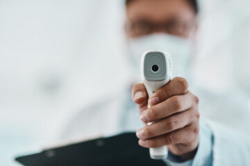 Sticker - Isnt it time you got tested. Shot of a doctor using an infrared thermometer during an outbreak.