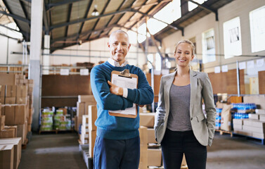 Aufkleber - Your shipment left the warehouse today. Portrait of two managers standing in a distribution warehouse.