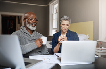 Wall Mural - Taking control of their finances. Shot of a senior couple working on their finances at home.