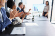 © Katleho S/peopleimages.com - Celebrating another successful presentation. Cropped shot of businesspeople applauding a colleagues presentation during a boardroom meeting.