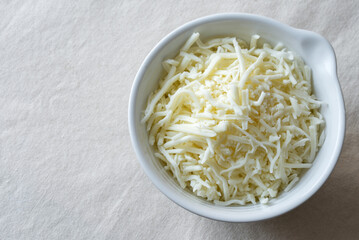 Wall Mural - Shredded Mozzarella Cheese in a Bowl