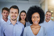 © Arnéll Koegelenberg/peopleimages.com - Confidence stands with this team. Portrait of a confident group of businesspeople standing in an office.