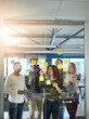 © Delmaine Donson/peopleimages.com - Harnessing the mind power of a team. Shot of colleagues having a brainstorming session with sticky notes at work.