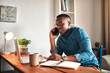 © Chanelle Malambo/peopleimages.com - Sealing the deal over the phone. Cropped shot of a handsome young businessman sitting alone in his home office and talking on his cellphone.