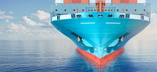 Front View Of Large Blue Container Cargo Ship In Ocean Waters. Performing Cargo Export And Import Operation.