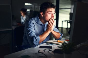 Sticker - Being productive is about persevering. Cropped shot of a young attractive businessman working late in the office.