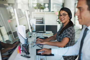 Canvas Print - Ready and available to take your call. Portrait of a happy and confident young woman working in a call center.