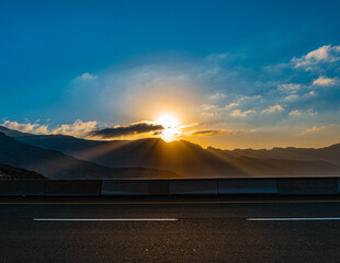 Wall Mural - sun rising behind the clouds
