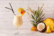Traditional caribbean cocktail pina colada in a glass.