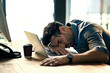 © Jadon Bester/peopleimages.com - Defeated by the deadline. Shot of an exhausted young businessman sleeping at his desk during a late night at work.
