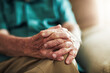 © Nola Viglietti/peopleimages.com - Your hands speak a thousand words. Cropped shot of an unrecognizable senior male sitting with his hands on his knee indoors.