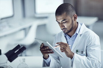 Sticker - My final results match up with my hypothesis. Shot of a scientist recording his findings on a digital tablet.