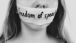© Olga - Concept on the theme of freedom of speech: a woman's face is sealed with tape with the inscription Freedom of speech. Concept on the theme of freedom of speech: a woman's face is sealed with tape with