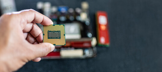 Closeup, Man holding CPU (Central processor Unit), Concept for fix, repair, mend,  restore, service, cobble, retrieve, recondition, selective focus, copy space on right for design, blurred background