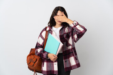 Wall Mural - Teenager Ukrainian student isolated on white background covering eyes by hands. Do not want to see something