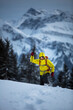 © lightpoet - Young man snowshoeing in high mountains, enjoying splendid winter weather with abundance of snow