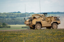 British Army Supacat Jackal 4x4 Rapid Assault, Fire Support And Reconnaissance Vehicle On A Military Battle Training Exercise, Wiltshire UK