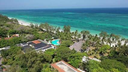 Wall Mural - Diani beach Kenyan coast African Sea drone aerial 4k waves blue indan ocean tropical mombasa turquoise white sand East Africa palms paradise hotel view diani sea sesort lodge Kenya landscape 