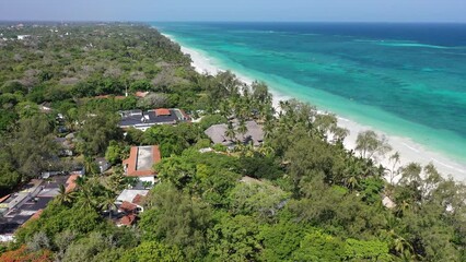 Wall Mural - Diani beach Kenyan coast African Sea drone aerial 4k waves blue indan ocean tropical mombasa turquoise white sand East Africa palms paradise hotel view diani sea sesort lodge Kenya landscape 