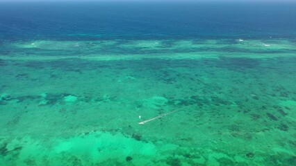 Wall Mural - wind kitesurfing kitebording on water sea Drone view Coastline Diani beach landscape Kenyan African Sea  aerial 4k waves indan ocean tropical mombasa turquoise white sand East Africa palms paradise