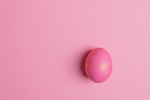 One Easter Pink Egg On A Pink Background
