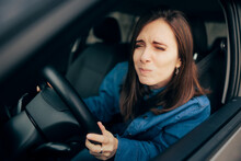 Woman Squinting And Driving Not Having Proper Visibility