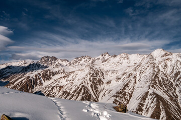 Wall Mural - Snowy Greater Caucasus ridge. Sunny day. Before suset. View from 3500m