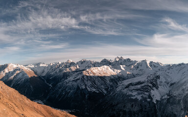 Wall Mural - Panoramic view of mountain range of the Caucasus Mountains. View from the top of the mountain. Elbrus region