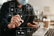 © NINENII - Businessman hand working digital marketing media in virtual screen with mobile phone and modern compute with VR icon diagram at office.