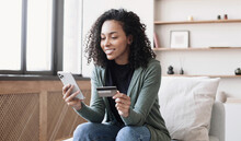 Woman Holding Credit Card And Using Smartphone At Home, Businesswoman Shopping Online, E-commerce, Internet Banking, Spending Money, Working From Home Concept
