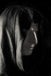 Concept mysterious portrait monk pastor gypsum head in hooded cape
