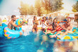 © alphaspirit - Group of friends in swimsuit enjoy in a swimming pool