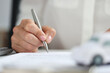 © megaflopp - Hands of client signing car rental form closeup